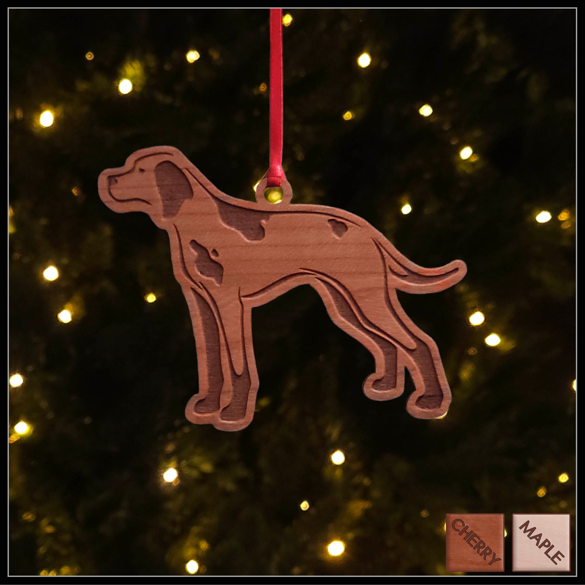A English Pointer cherry wood veneer ornament, with the dog in profile. 