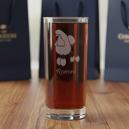 15oz Cooler Glass with an etched poodle with gift bags in the background.