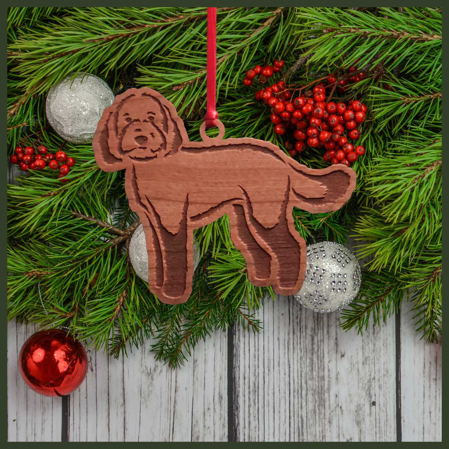 A Labradoodle cherry wood veneer ornament, with the dog in profile.