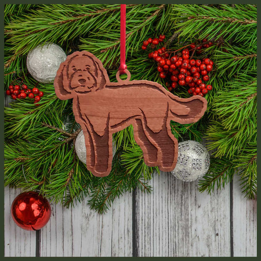 A Labradoodle cherry wood veneer ornament, with the dog in profile.