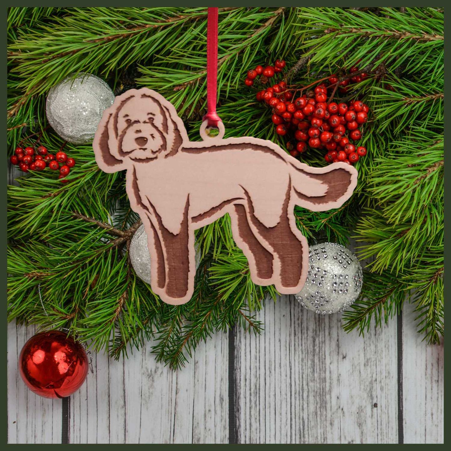 A Labradoodle maple wood veneer ornament, with the dog in profile.