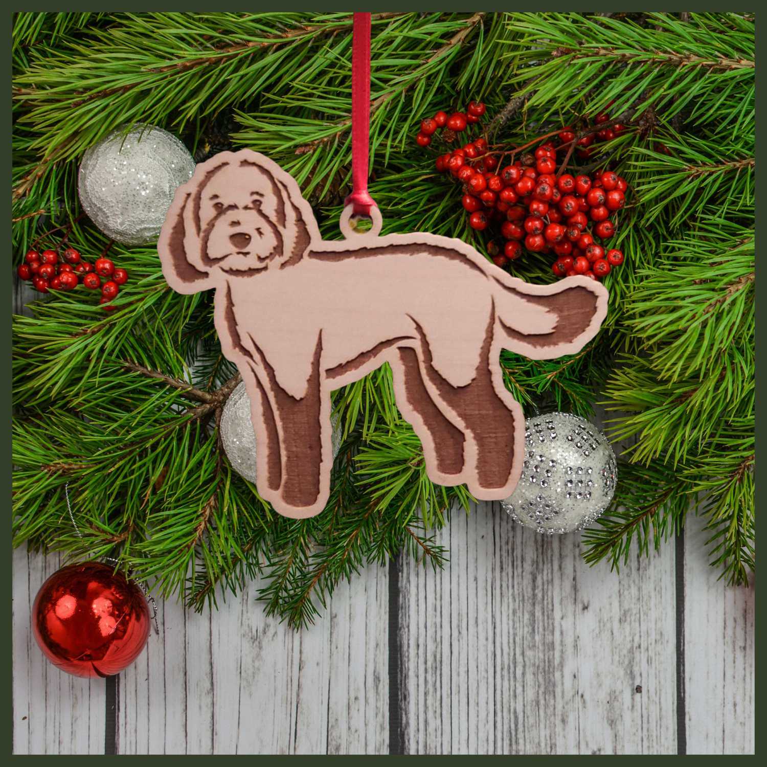 A Labradoodle maple wood veneer ornament, with the dog in profile.