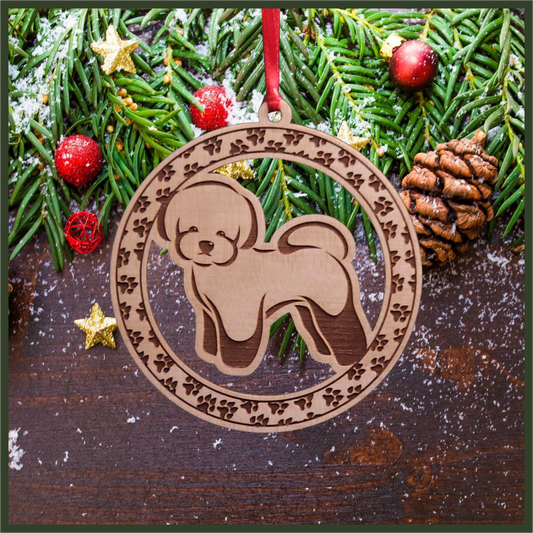 A round maple wood veneer ornament with a border of small paw prints. The center of the ornament is a Bichon Frisé dog