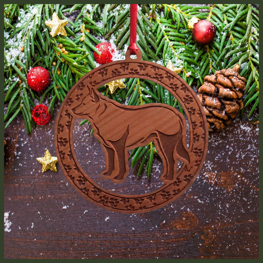 A round cherry wood veneer ornament with a border of small paw prints. The center of the ornament is a blue heeler dog