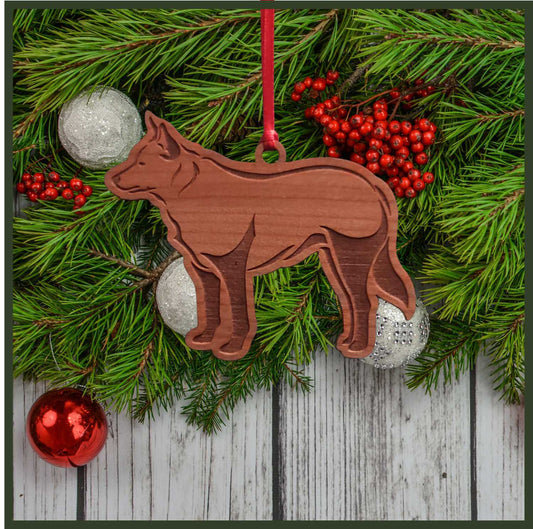 A Blue Heeler cherry wood veneer ornament, with the dog in profile. 