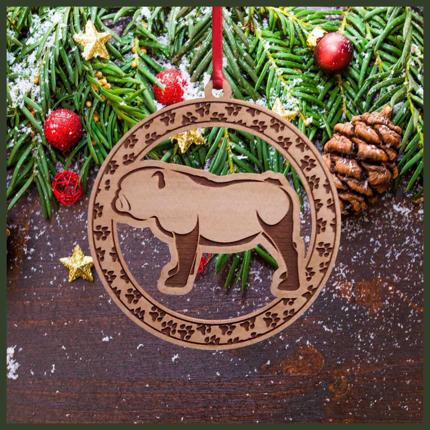 A round maple wood veneer ornament with a border of small paw prints. The center of the ornament is a bulldog