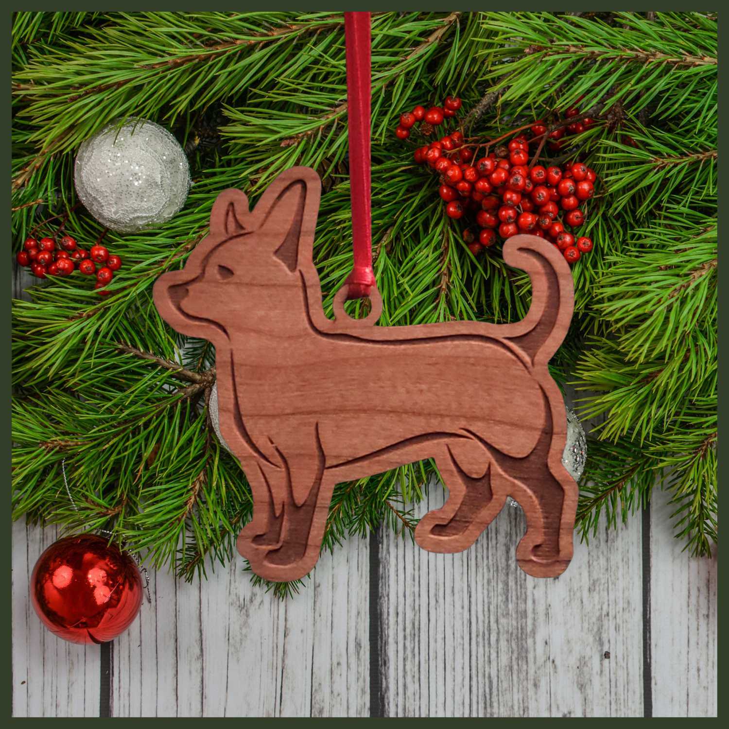 A Chihuahua cherry wood veneer ornament, with the dog in profile. 
