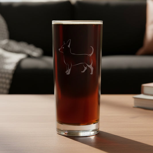 Cooler glass with a etched chihuahua dog with a black couch  in the background 