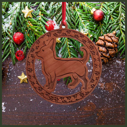 A round cherry wood veneer ornament with a border of small paw prints. The center of the ornament is a chihuahua dog