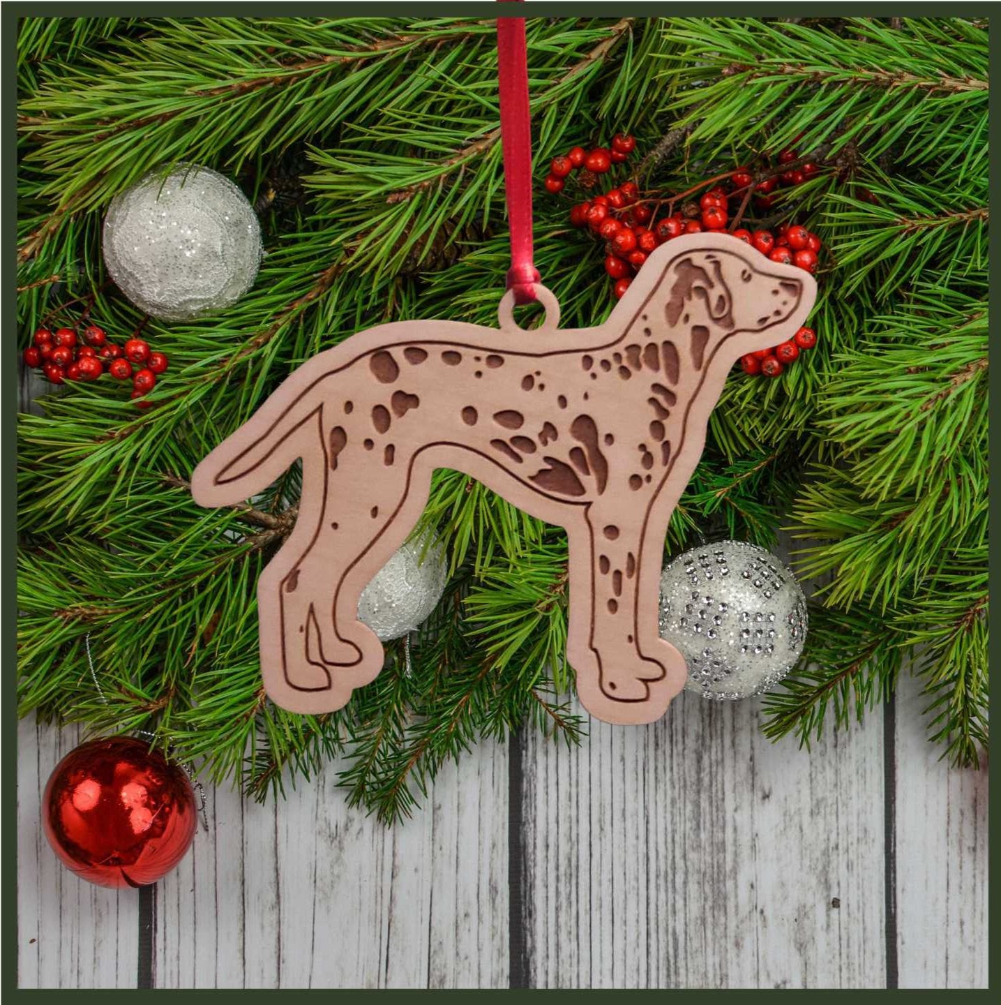A Dalmation maple wood veneer ornament, with the dog in profile. 