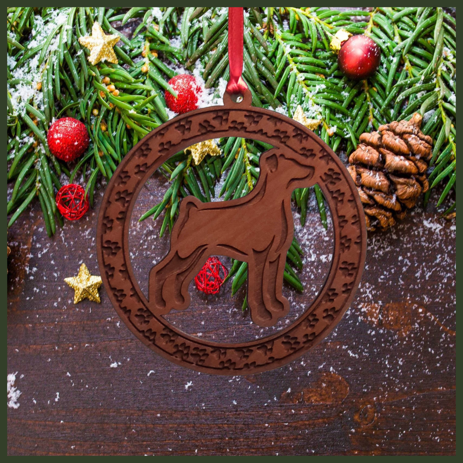A round maple wood veneer ornament with a border of small paw prints. The center of the ornament is a Doberman dog.