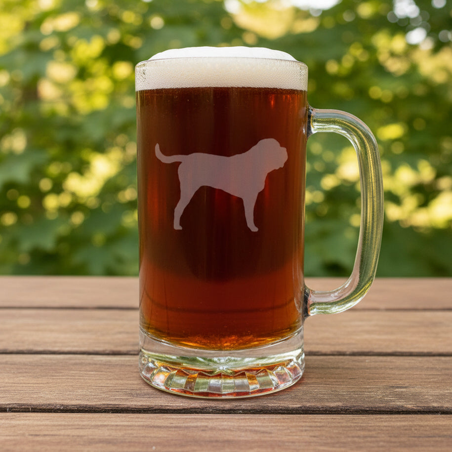 Etched English Mastiff design on a beer glass with a handle with a black counch in the background