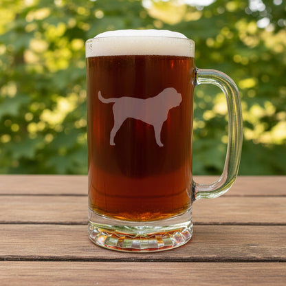 Etched English Mastiff design on a beer glass with a handle with a black counch in the background