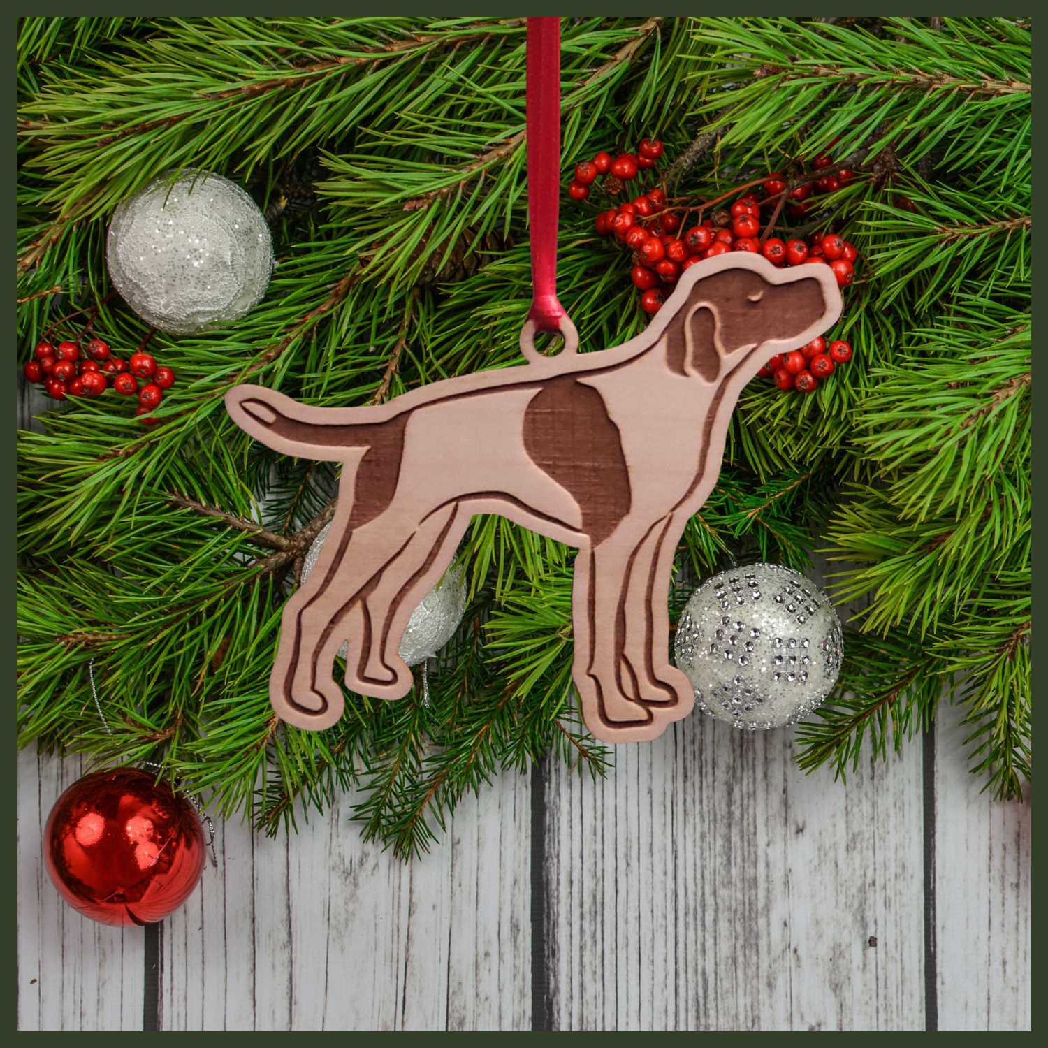 A English Pointer maple wood veneer ornament, with the dog in profile. 
