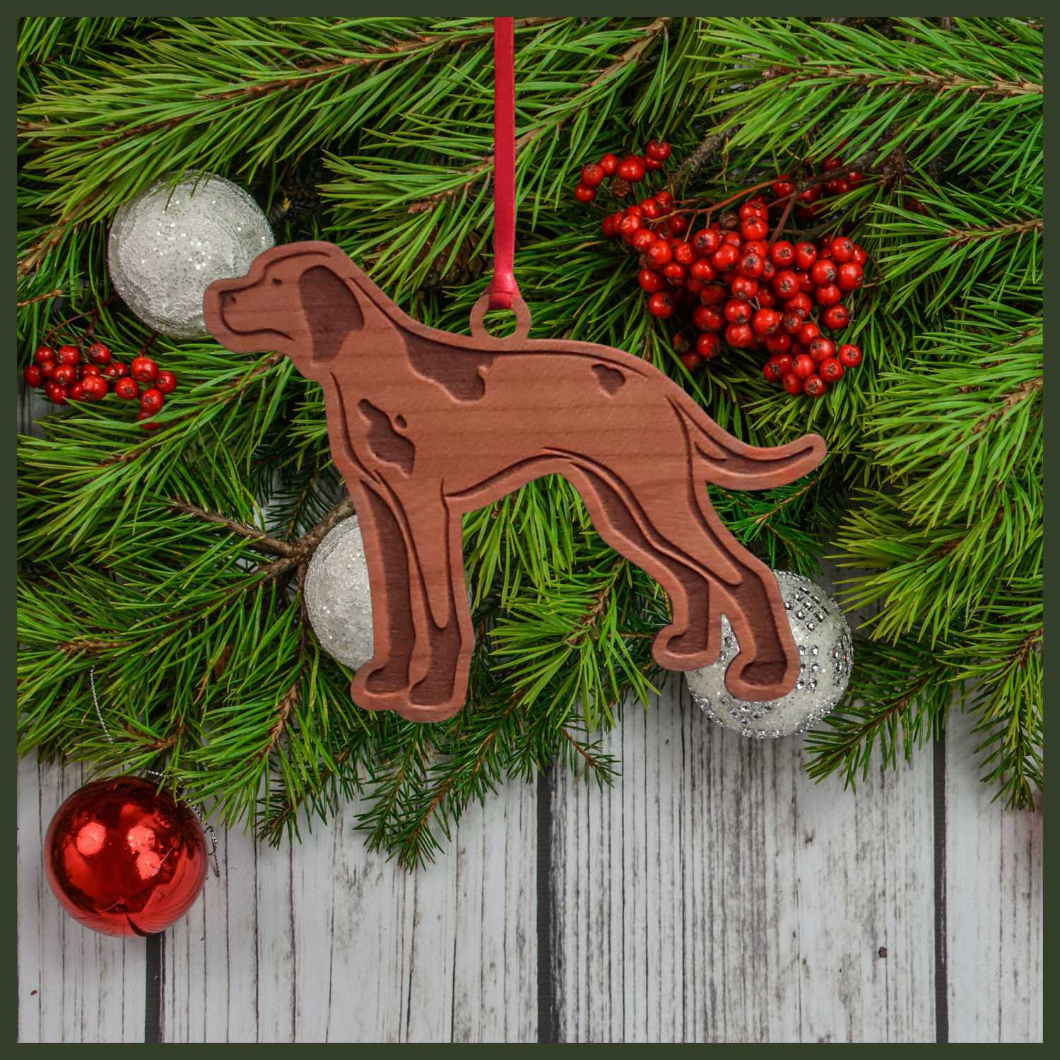 A English Pointer cherry wood veneer ornament, with the dog in profile. 
