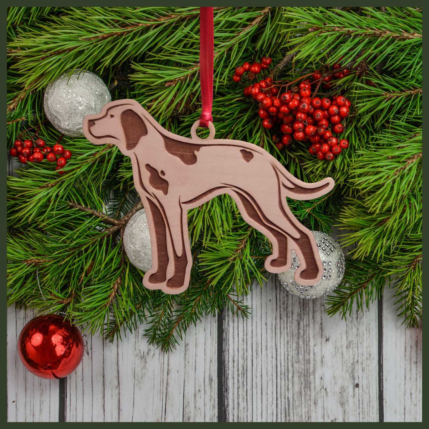 A English Pointer maple wood veneer ornament, with the dog in profile. 