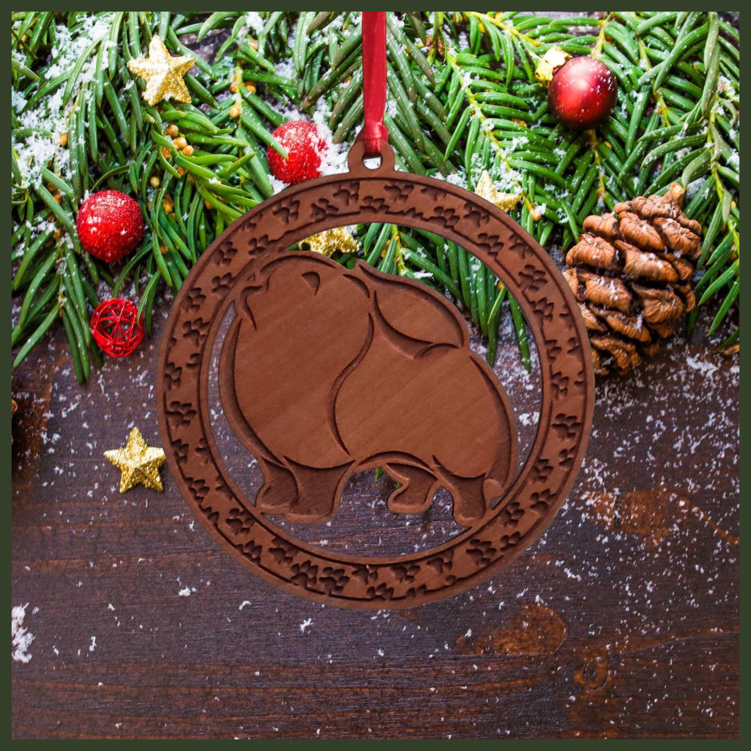 A round cherry wood veneer ornament with a border of small paw prints. The center of the ornament is a Pomeranian dog.