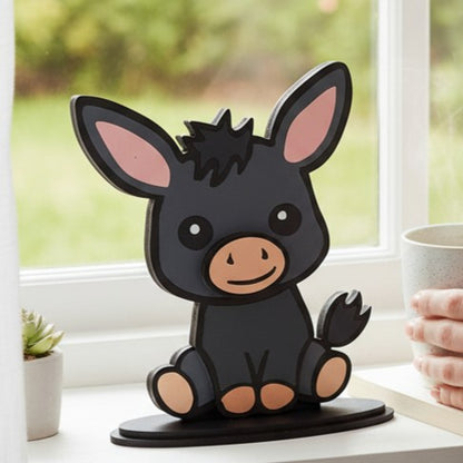 Cartoon donkey shelf decor on a windowsill with a blurred background