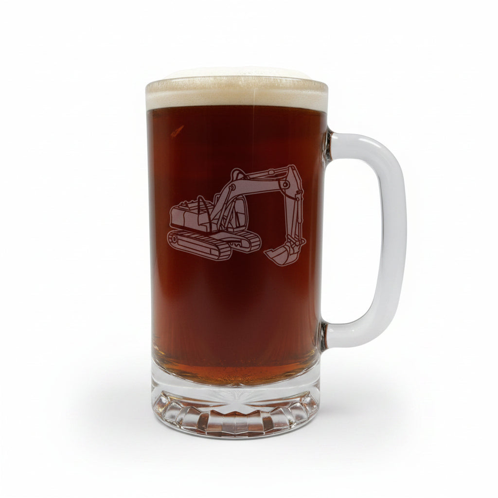 A clear glass beer stein mug with a handle, filled with dark brown beer and topped with white foam, featuring an etched excavator design on the front. White Background