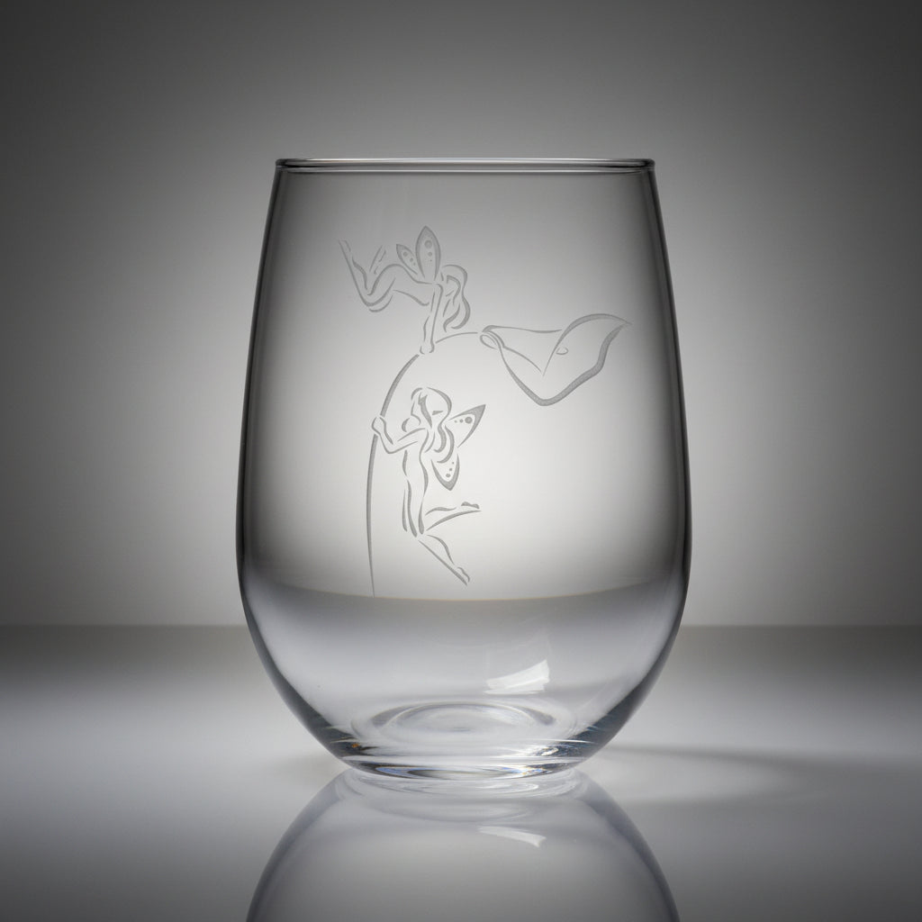 Clear glass with etched design of  fairies hovering on the stem of a lily flower