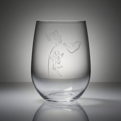 Clear glass with etched design of  fairies hovering on the stem of a lily flower