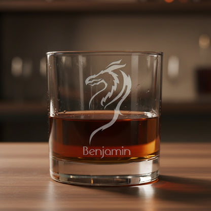 Glass tumbler with a dragon design and 'Benjamin' text, filled with a red liquid 