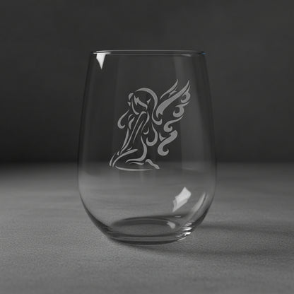 Clear glass with an angel design on a grey background