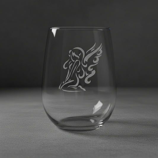 Clear glass with an angel design on a grey background