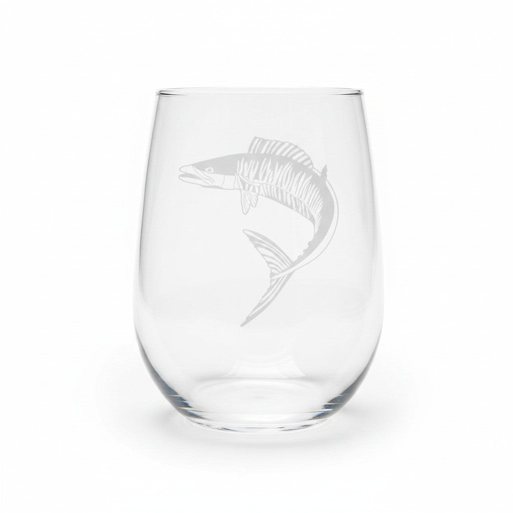 A clear stemless wine glass featuring an etched fish design on the front, set against a plain white background.