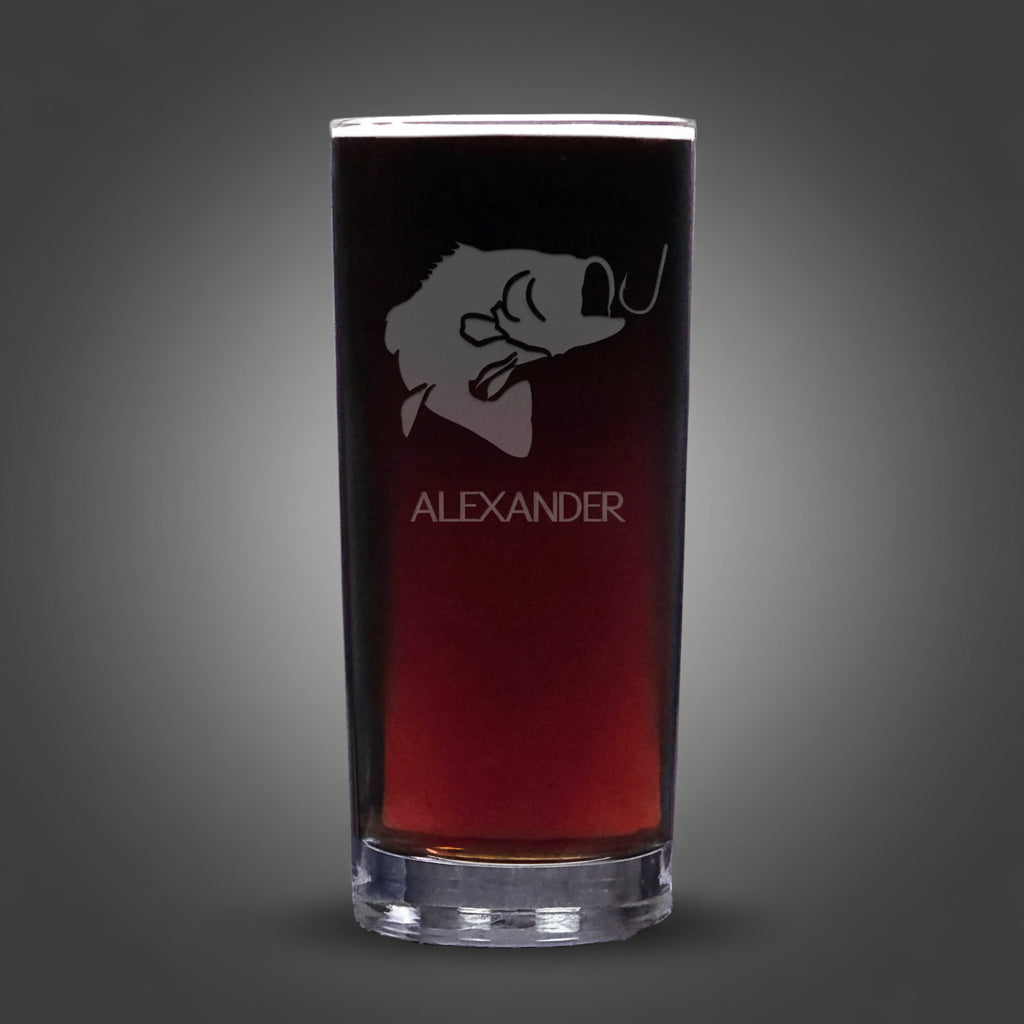 Cooler glass with engraved face and 'Alexander' text on a gray background