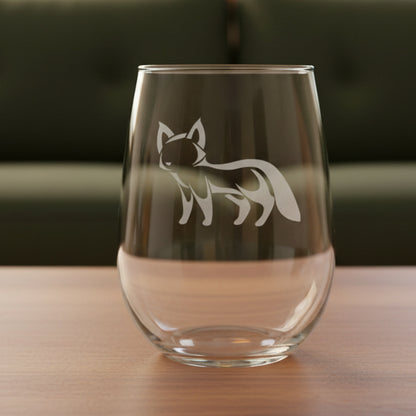 17oz Stemless Wine Glass with an etched image of a fox 
and a green couch in the background
