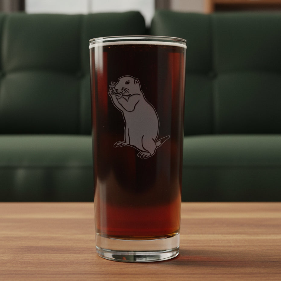 15oz Cooler Glass with an etched image of a gopher and a green couch in the background
