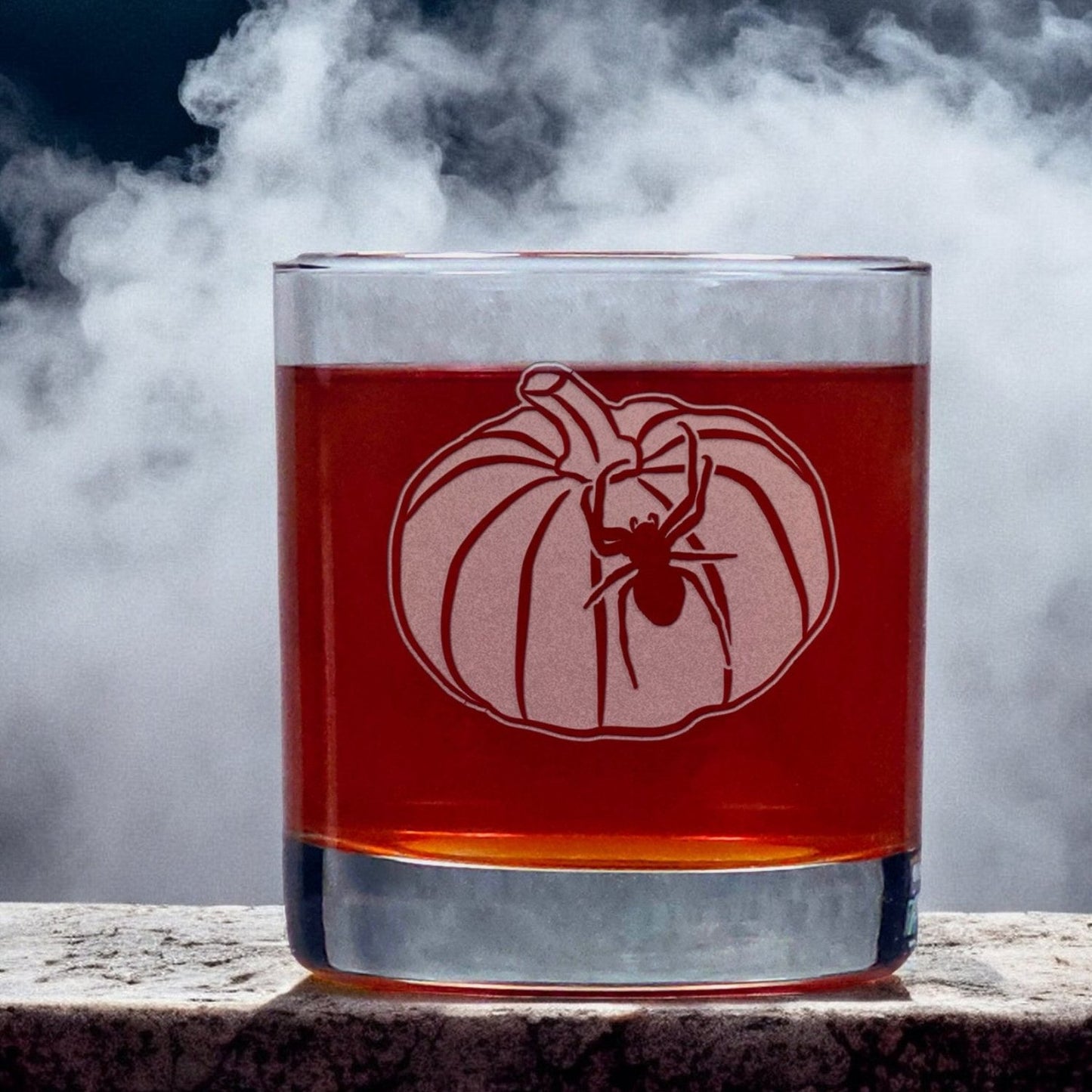 An image of an 11oz whiskey glass an image of a pumpkin with a spider crawling up the side