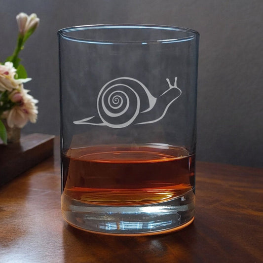 13oz whiskey glass  with an image shaped outline of a snail - copyright Hues in Glass