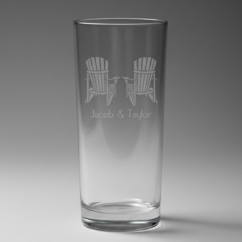 Black pint glass with engraved design of two Adirondack chairs and 'Jacob & Taylor' text on a white background.