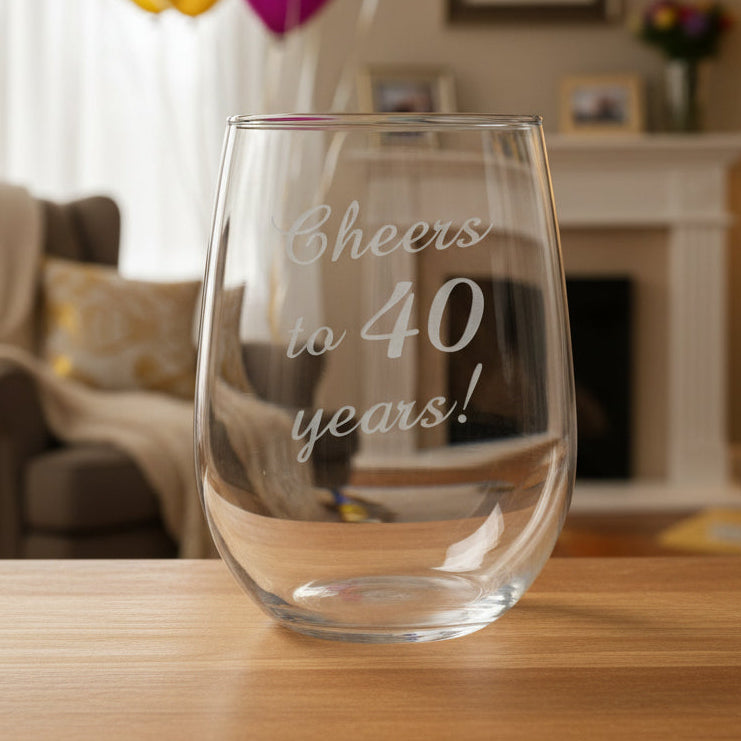 Clear glass stemless wine glass with 'Cheers to 40 years!'