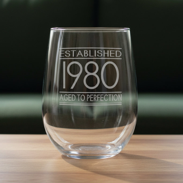 Clear glass with engraved text 'Established 1980 Aged to Perfection' 