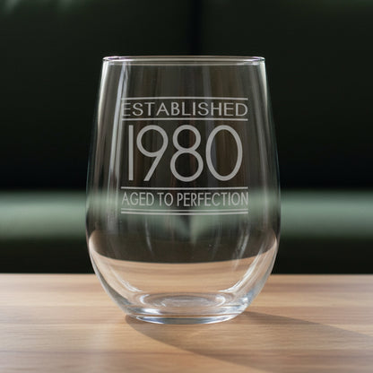 Clear glass with engraved text 'Established 1980 Aged to Perfection' 