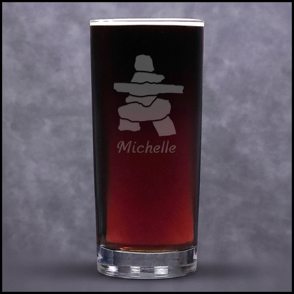 A clear cooler glass tumbler, featuring a frosted etched design of a Inuksuk with name personalization below.