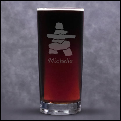 A clear cooler glass tumbler, featuring a frosted etched design of a Inuksuk with name personalization below.