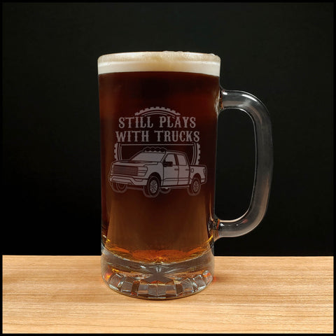 Truck Design Beer Mug with the "Still Plays with Trucks" in uppercase Dark Beer - Copyright Hues in Glass