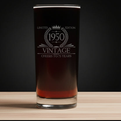 Glass with '1950 Vintage' text on a dark 
background