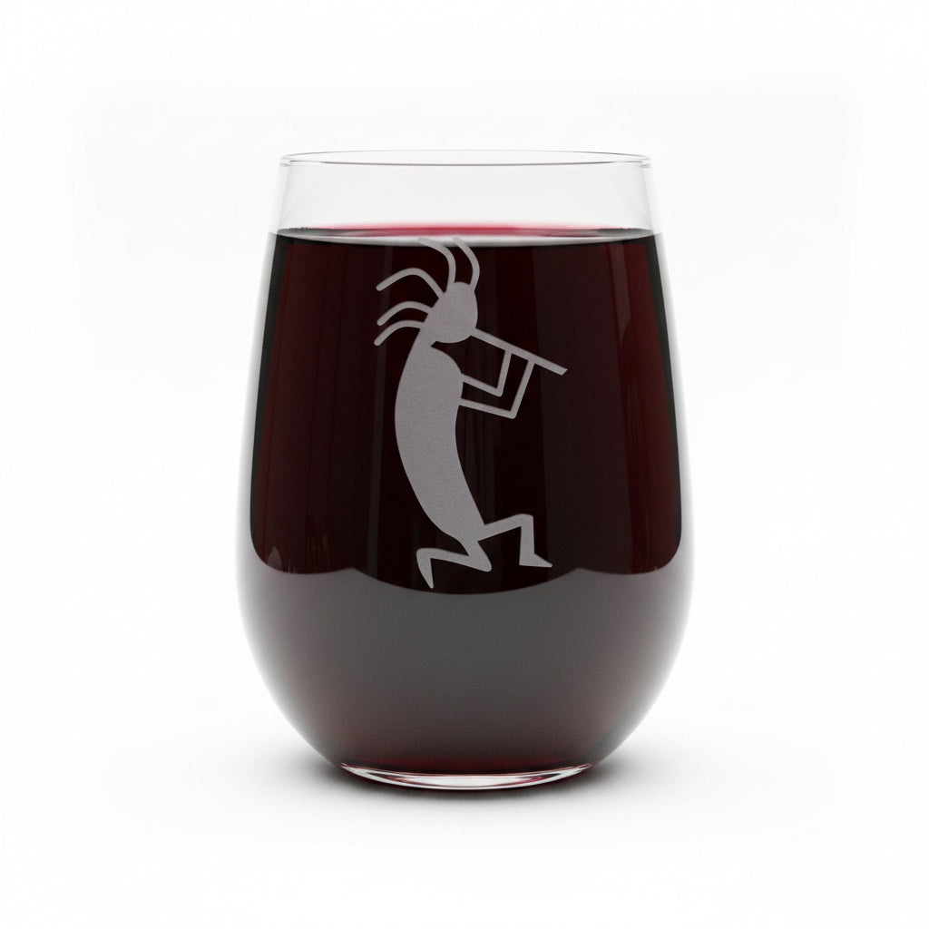 17oz Stemless wine glass filled with red wine with an etched kokopelli design 