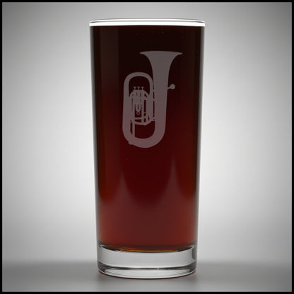 Cooler glass with a sand etched image of a tuba - with a light grey background 