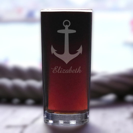 Glass with anchor design and 'Elizabeth' text on a blurred background