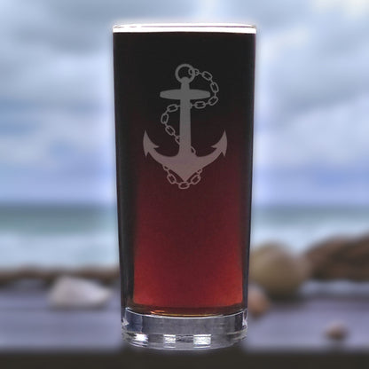 Glass with anchor design on a blurred beach background