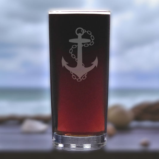 Glass with anchor design on a blurred beach background