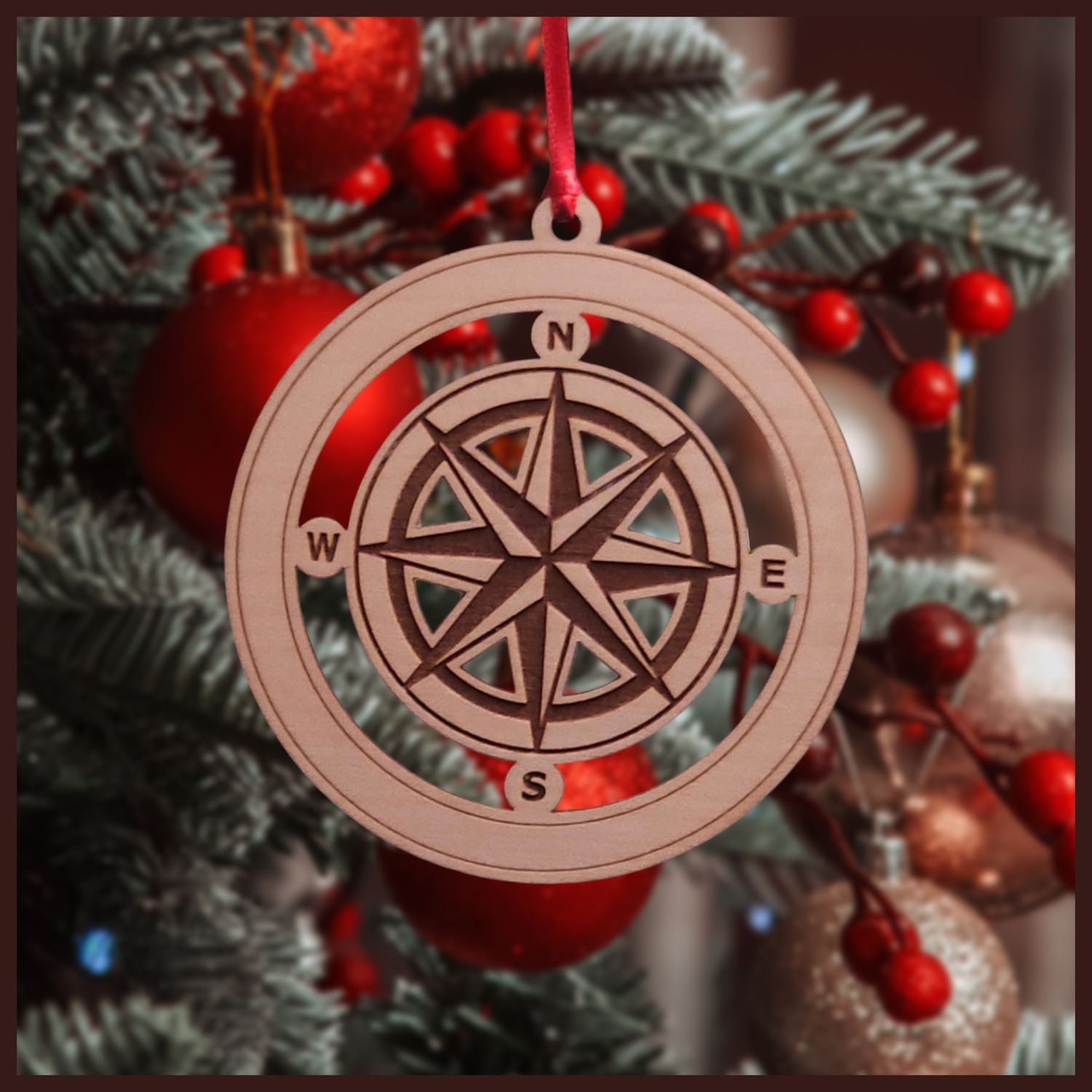 Maple veneered ornament with a nautical compass rose cut out.