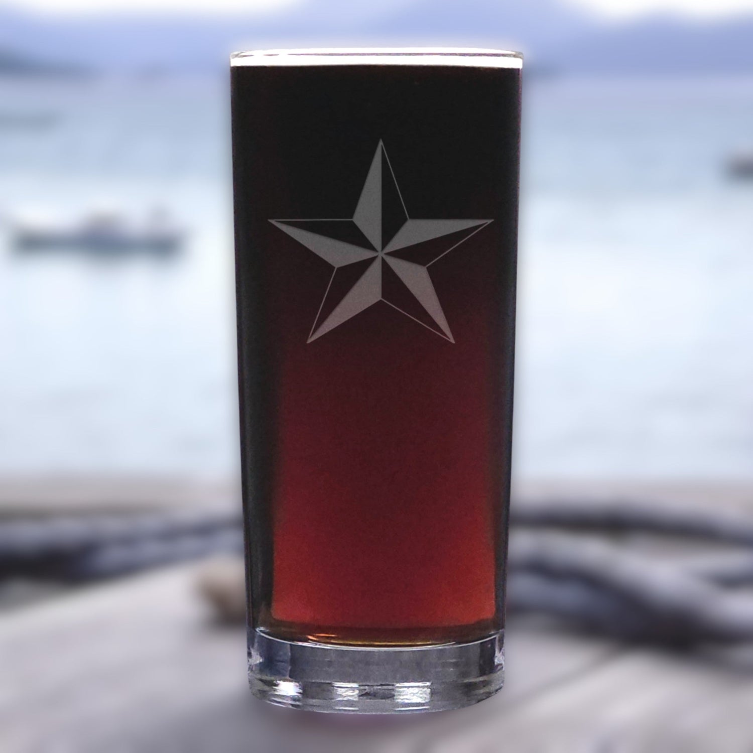 Glass with a star design on a blurred background