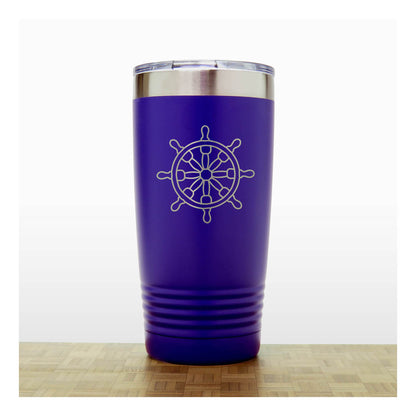 Purple tumbler with a white ship's wheel design on a wooden surface.
